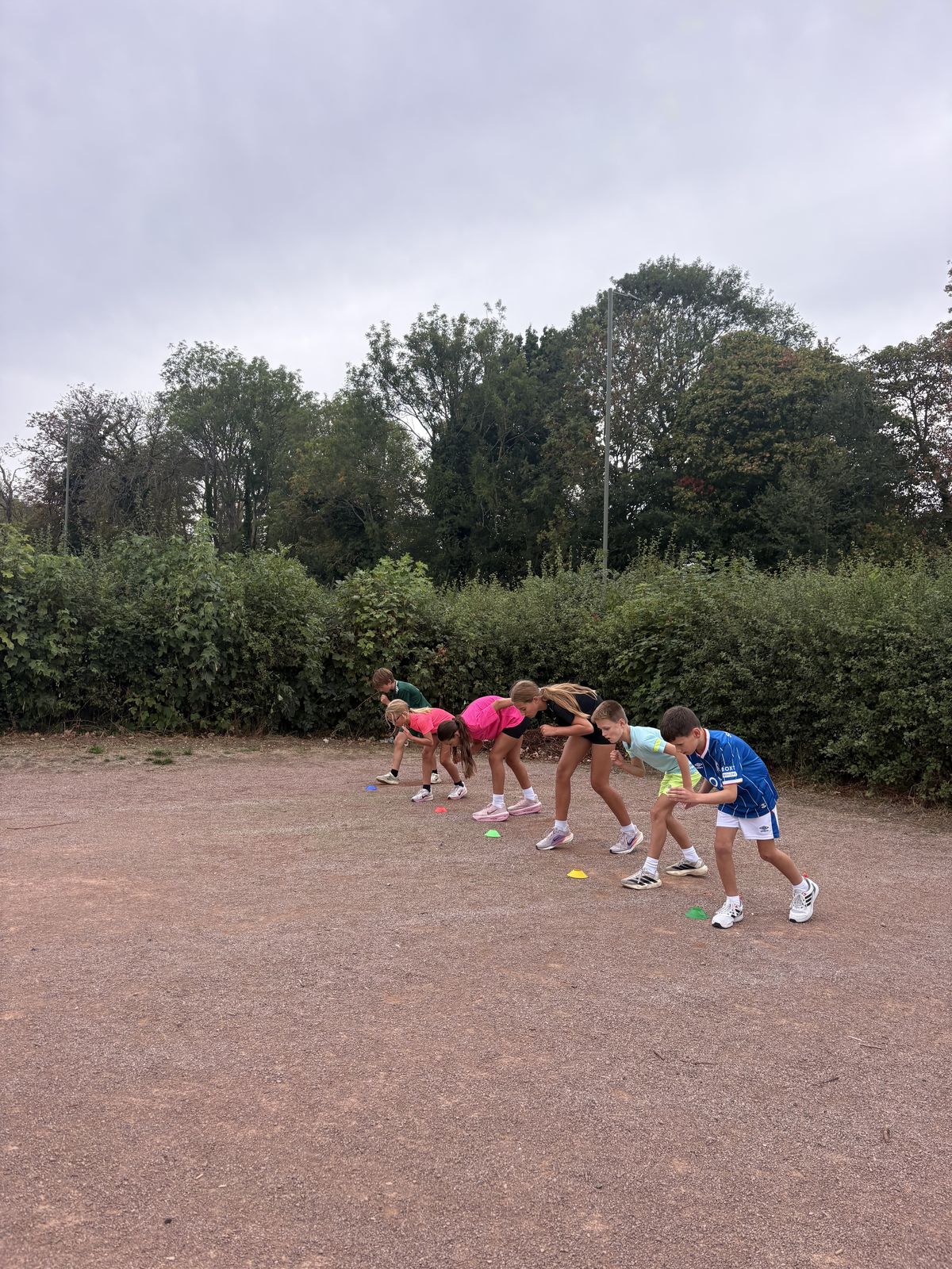 A group set on the start line at a training session