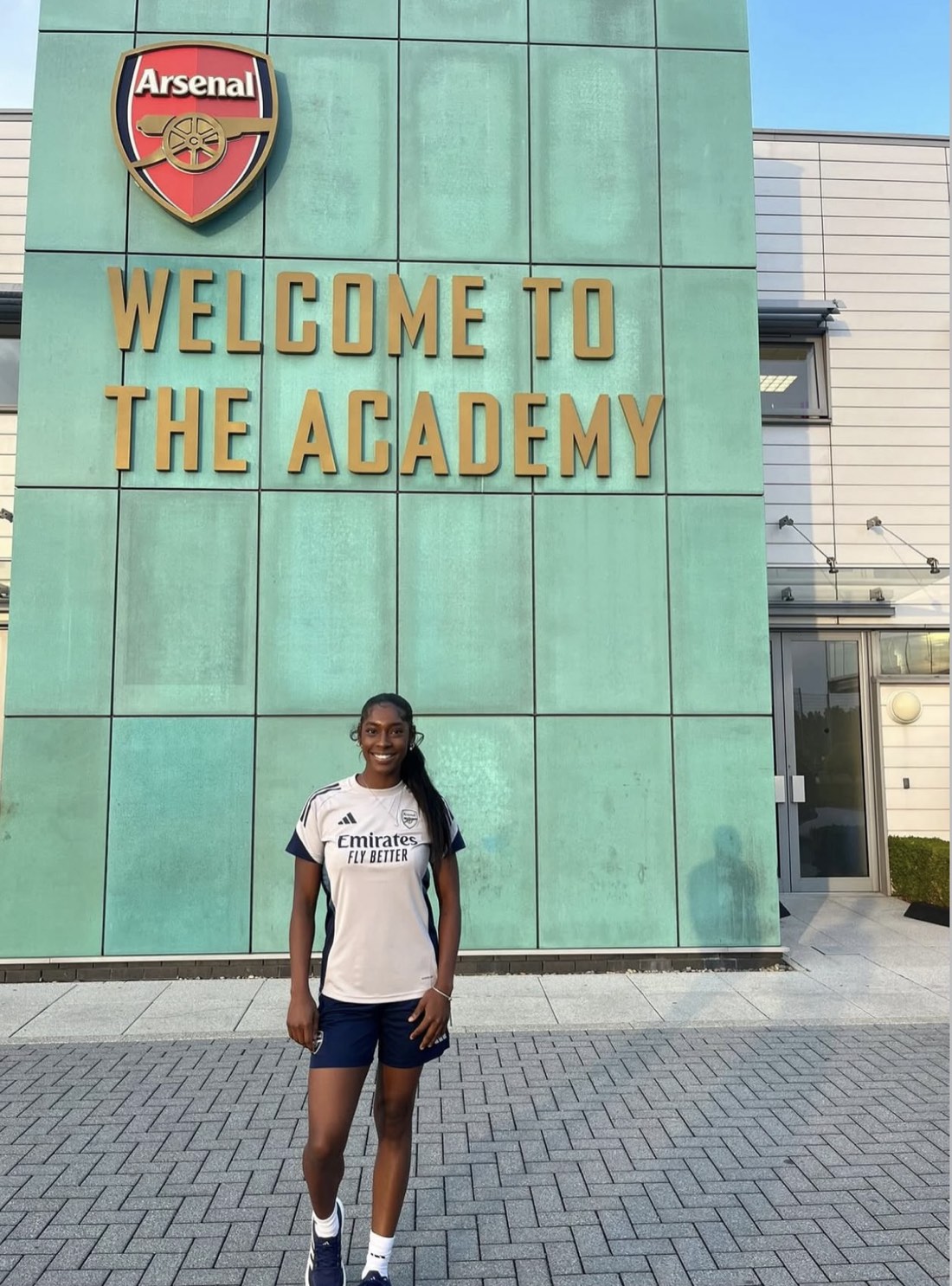 Natasha Alfred in Arsenal training kit outside the Arsenal Academy